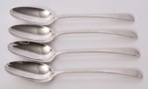 A set of four Victorian Old English pattern tablespoons, feather edge detail and engraved with a