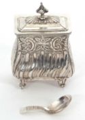 A late Victorian silver bombé shaped tea caddy, chased and engraved with a flowers and foliage