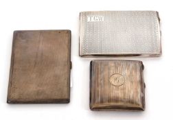A group of three silver hallmarked cigarette cases, engine turned decorated, engraved with initials,
