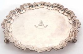 A late Victorian silver salver, having a moulded Chippendale border, plain ground with a central