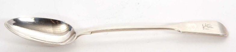 A Victorian fiddle pattern basting spoon, engraved with a crest, hallmarked for Lond 1839, makers