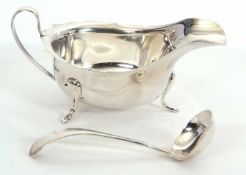 Mixed Lot: A George Vi silver sauce boat of typical form having a wavy rim and a loop handle,