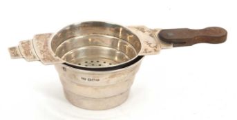 An Art Deco silver tea strainer and bowl, hallmarked for Sheffield 1936, makers mark for E Viners