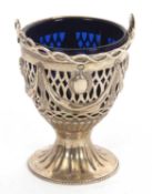 George III silver swing handle basket and blue glass liner, pierced with a classical swag and tail
