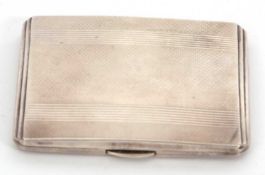 A George VI silver cigarette case of rectangular form, engine turned decorated, full length hinge