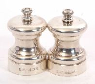 A pair of Elizabeth II silver capstan salt and pepper grinders/mills, hallmarked for Birmingham