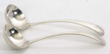 A pair of George V silver sauce ladles, Old English pattern, having large oval shaped bowls,