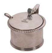A George III silver drum mustard pot and liner having gadrooned and reeded rims, the hinged lid