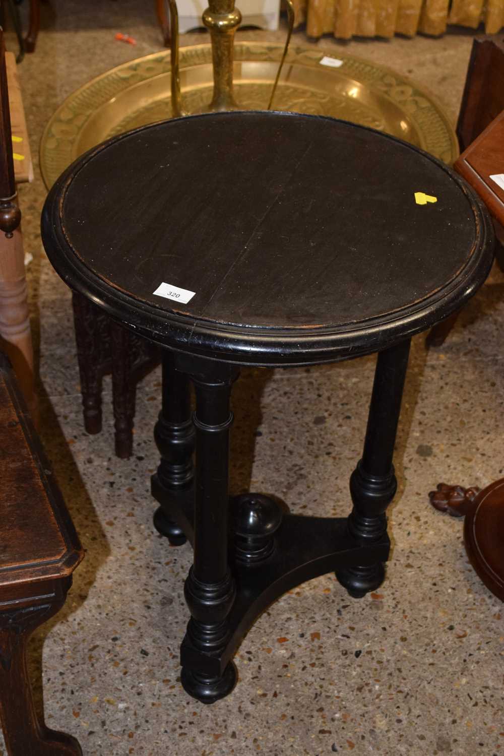 A late 19th or early 20th Century ebonised revolving top table