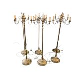 A set of six brass column standard lamps each with 3 branches to faux candles. wired (not tested)