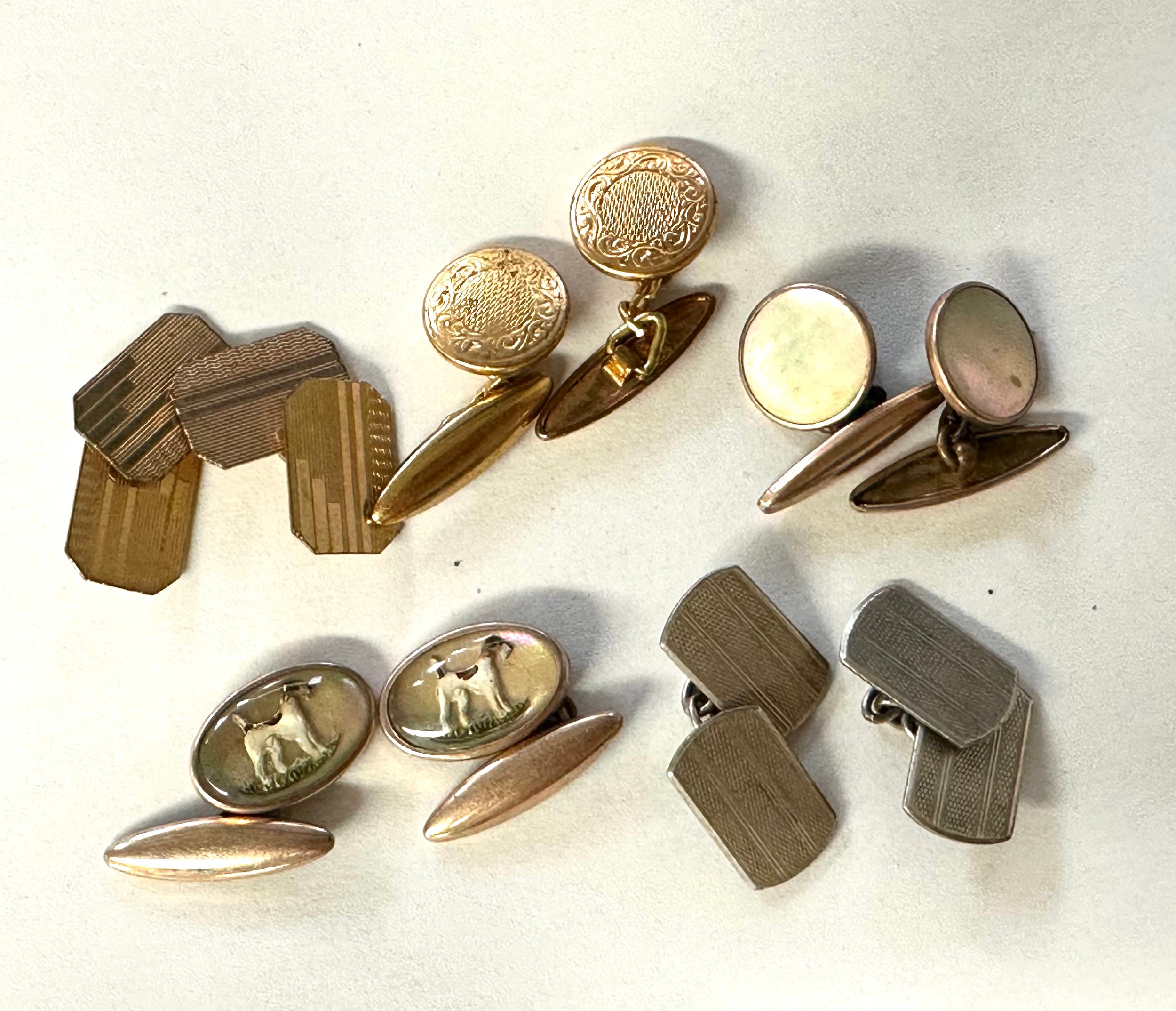 A pair of 9ct gold back and front double sided cuff links together with ...