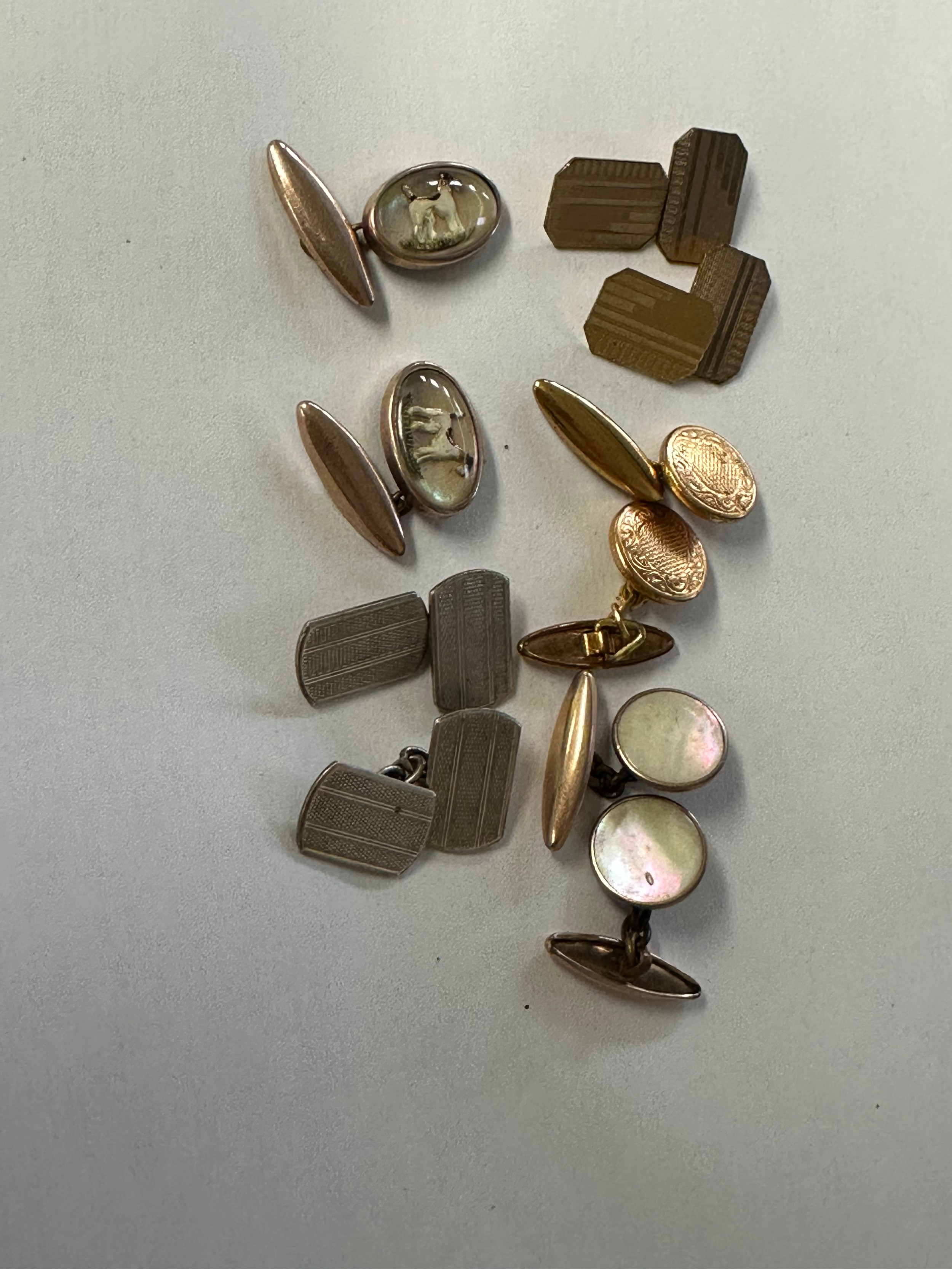 A pair of 9ct gold back and front double sided cuff links together with ...