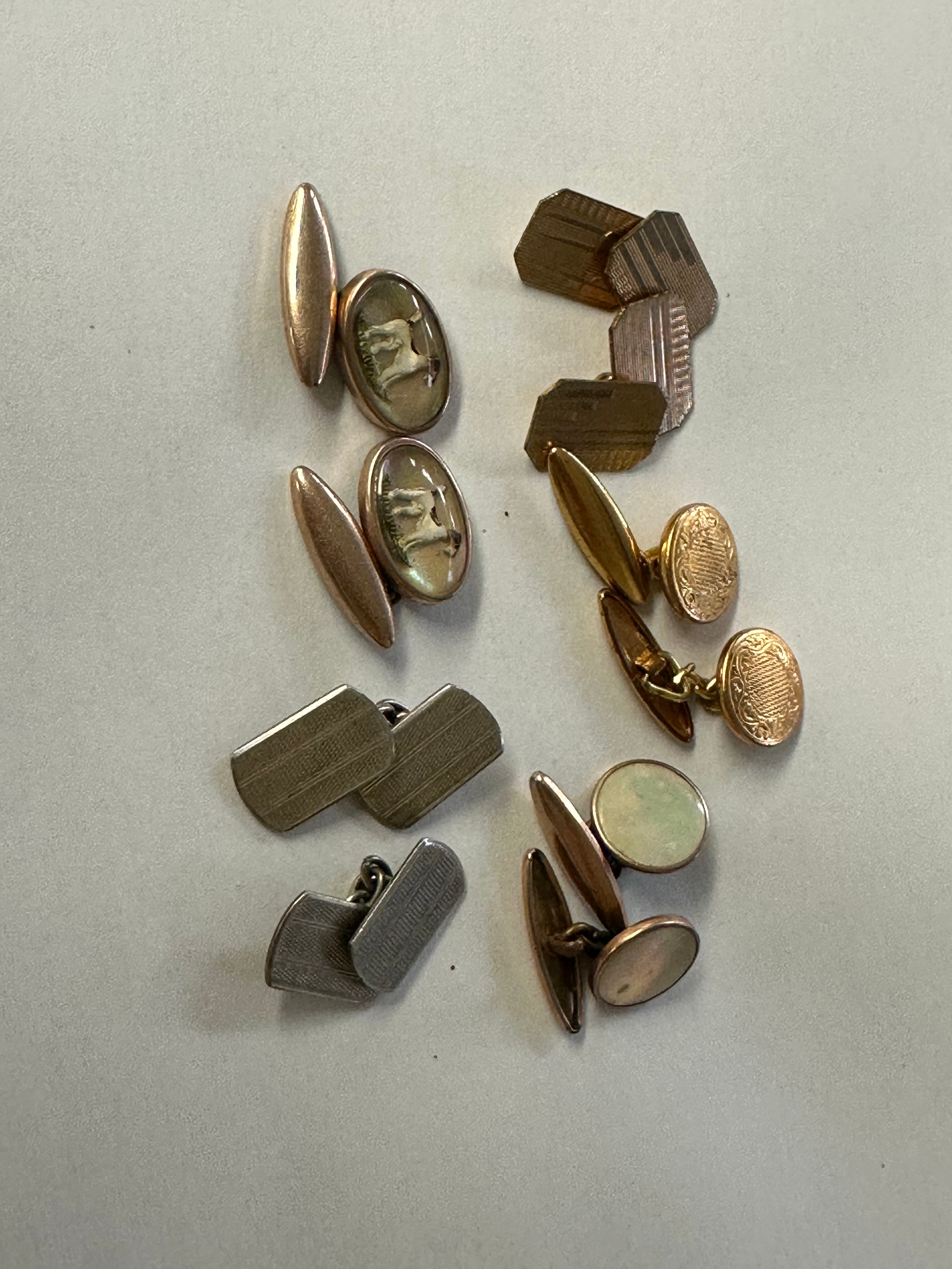 A pair of 9ct gold back and front double sided cuff links together with ...