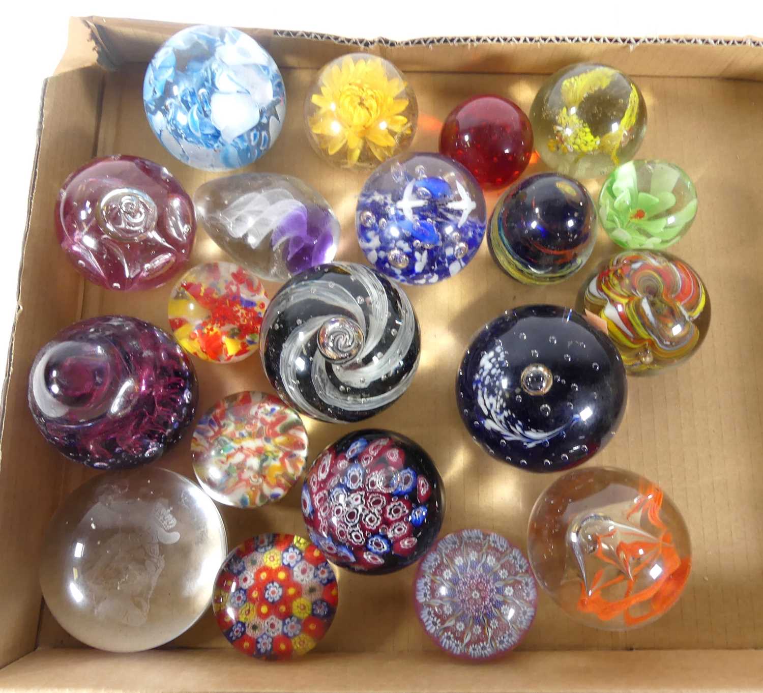 A collection of art glass paperweights, to include millefiori examples