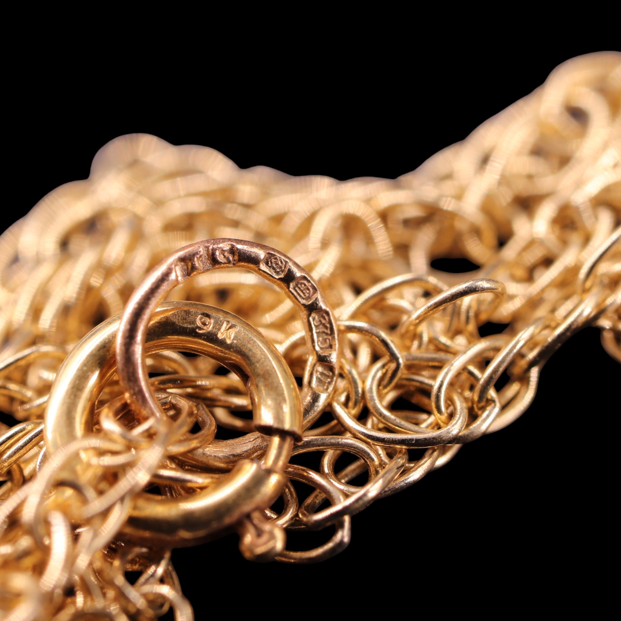Three variously rope and fine belcher link 9 ct yellow metal neck ...