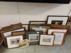 A collection of framed pictures and maps