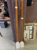 A pair of part painted wooden oars