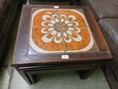 A nest of three tile topped occasional tables (A/F) Finish fading, knocks and scratches to areas