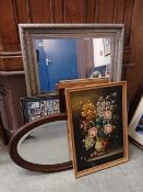 A collection of pictures, mirrors, etc