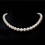A SINGLE STRAND CLASSIC ROUND PEARL NECKLACE.