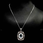AN AQUAMARINE AND DIAMOND PENDANT NECKLACE.