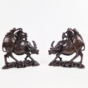 A PAIR OF CHINESE CARVED WOOD WATER BUFFALO. (2).
