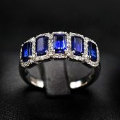 A PLATINUM SAPPHIRE AND DIAMOND DRESS RING.
