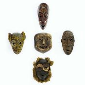 A COLLECTION OF AFRICAN AND INDIAN WALL MASKS. (5).