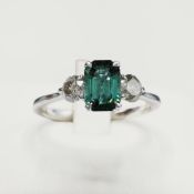 A PLATINUM TOURMALINE AND DIAMOND TRILOGY RING.