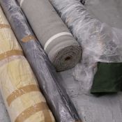 4 ROLLS OF FABRIC.