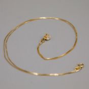 A 14CT GOLD DIAMOND SOLITAIRE PENDANT NECKLACE.