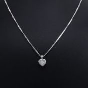 A PLATINUM AND DIAMOND PENDANT NECKLACE.