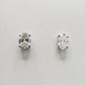 PAIR OF 18CT WHITE GOLD DIAMOND SOLITAIRE STUD EARRINGS.