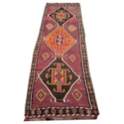 A TURKISH KILIM RUNNER.