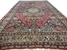 19TH CENTURY PERSIAN KIRMAN LAVER CARPET.