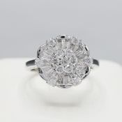 AN 18CT WHITE GOLD DIAMOND FLORAL DRESS RING.
