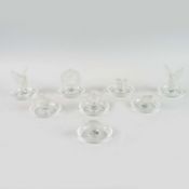 A LALIQUE SET OF EIGHT FIGURAL RING DISHES.