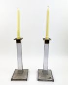 A PAIR OF ART DECO STYLE GLASS COLUMN BRASS CAPPED CANDLESTICKS. (2).
