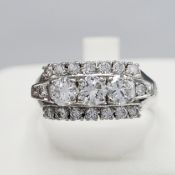 AN 18CT WHITE GOLD DIAMOND DRESS RING.