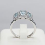 A PLATINUM AQUAMARINE AND DIAMOND DRESS RING.