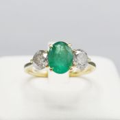 AN 18CT GOLD EMERALD AND DIAMOND RING.