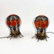 PAIR OF MOROCCAN WROUGHT METAL TABLE LAMPS WITH ORANGE RESIN SHADES.
