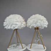 PAIR OF GILT METAL TRIPOD TABLE LAMPS WITH FAUX FEATHER SHADES.