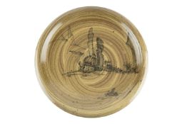 Malcolm Pepper (1937-1980) Footed charger decorated with a painted landscape unmarked 39cm across.