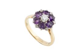 An amethyst and diamond cluster ring, the principal round brilliant-cut diamond claw set within a
