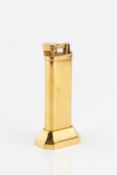 A gold plated table lighter by Dunhill, of 'tallboy' type, with reeded decoration, no. 20568, 10cm