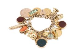 A charm bracelet, the curb-link bracelet stamped '9C', with padlock clasp, suspending a collection