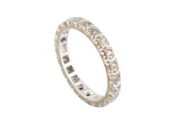 A diamond full hoop ring, inset with a line of single-cut diamonds, stamped '9CT', later rhodium