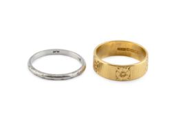 A 22ct gold wedding band, with floral engraved decoration, and a white metal wedding band, also
