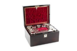 A 19th century rosewood toilet box, with mother o'pearl inset top, the interior fitted with a